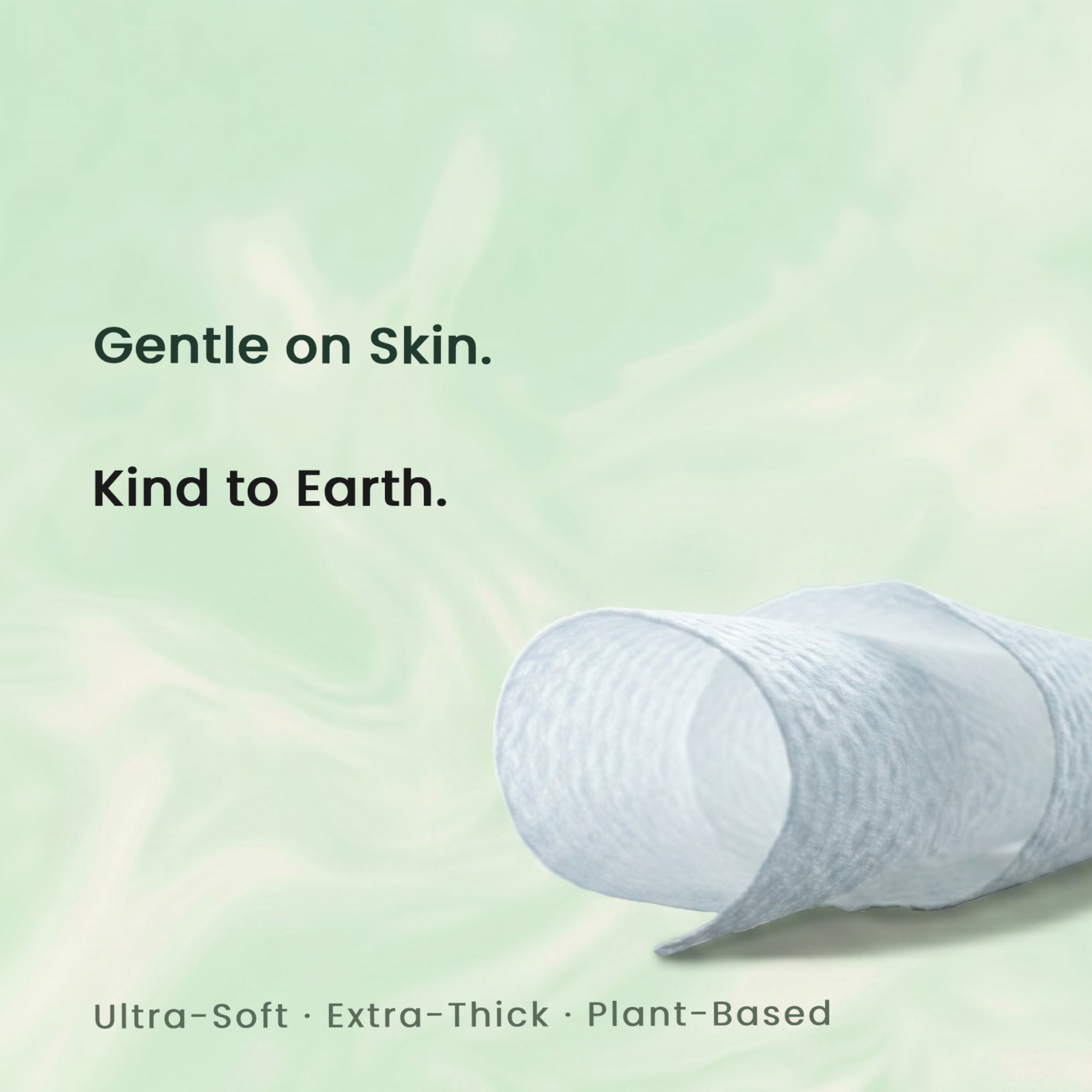 Roll of ultra-soft, extra-thick, plant-based product of inficare face towels with text 'Gentle on Skin. Kind to Earth.' on a light green background.