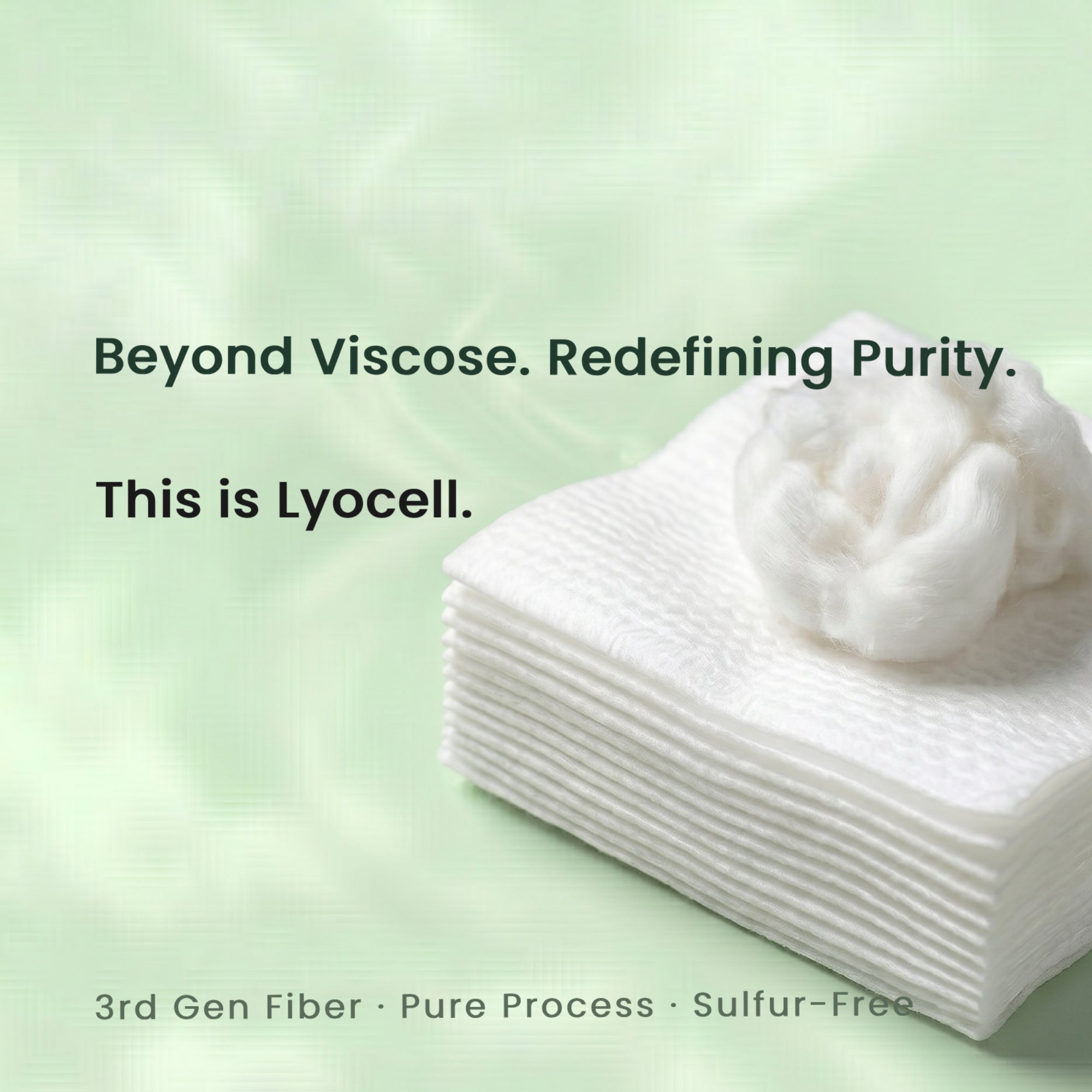 Stack of Lyocell fabric with text on a light green background. Beyond Viscose. Redefining Purity.